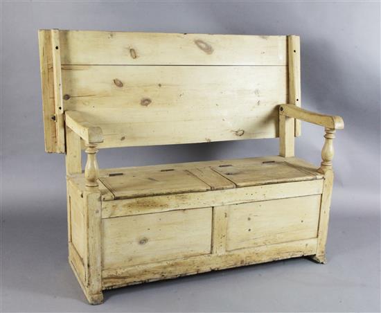 A stripped pine monks bench